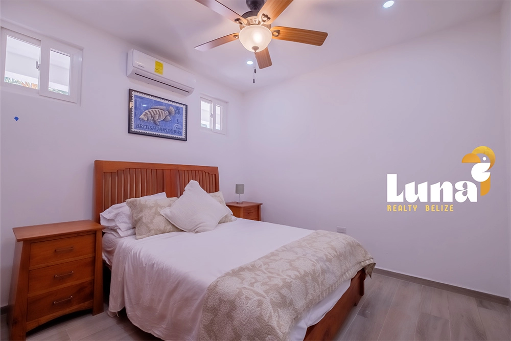 Bedroom with Large Windows and Natural Light at Ruby Villas